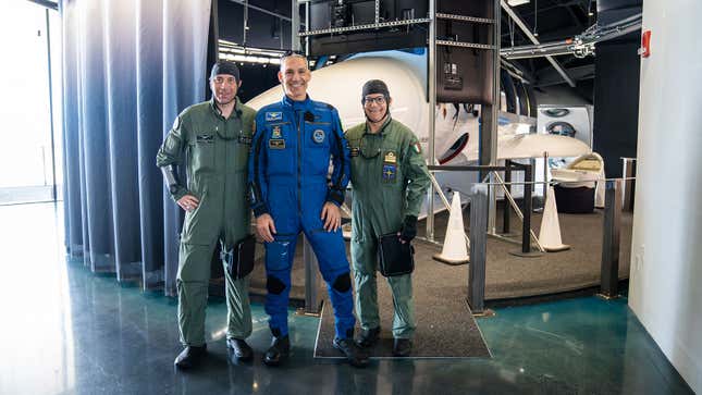 A photo of three passengers who will be flying with Virgin Galactic. 
